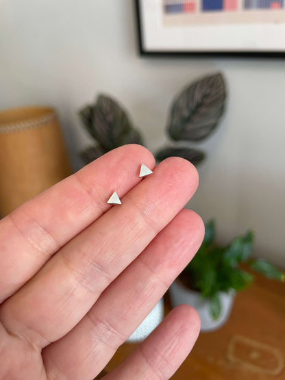 Minimal silver triangle studs